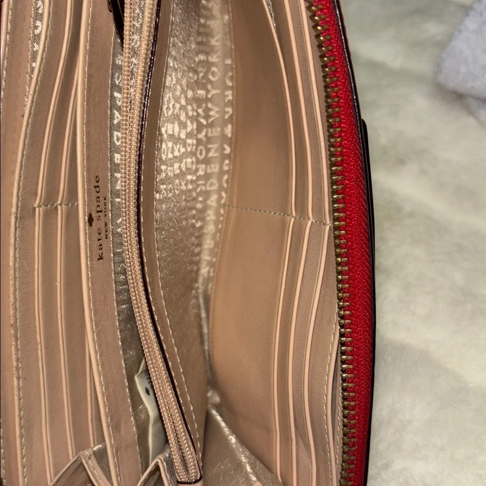 Kate Spade Red Pebbled Leather Zip Around Wallet with Logo Plate